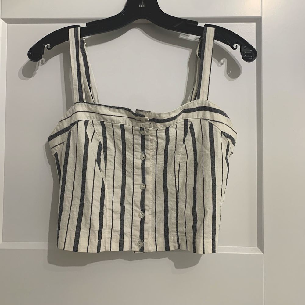 Brandy Melville tank top with adjustable straps and buttons down the center.